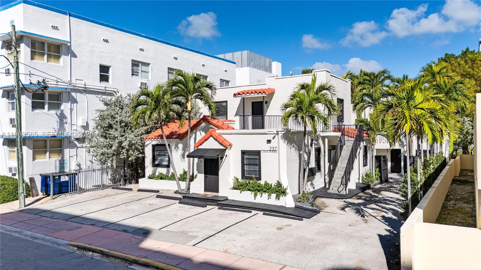 A two-story white stucco building with a red tile roof and palm trees outside — 237 38th St # 4, Miami Beach FL 33140, MIAMI BEACH, FL