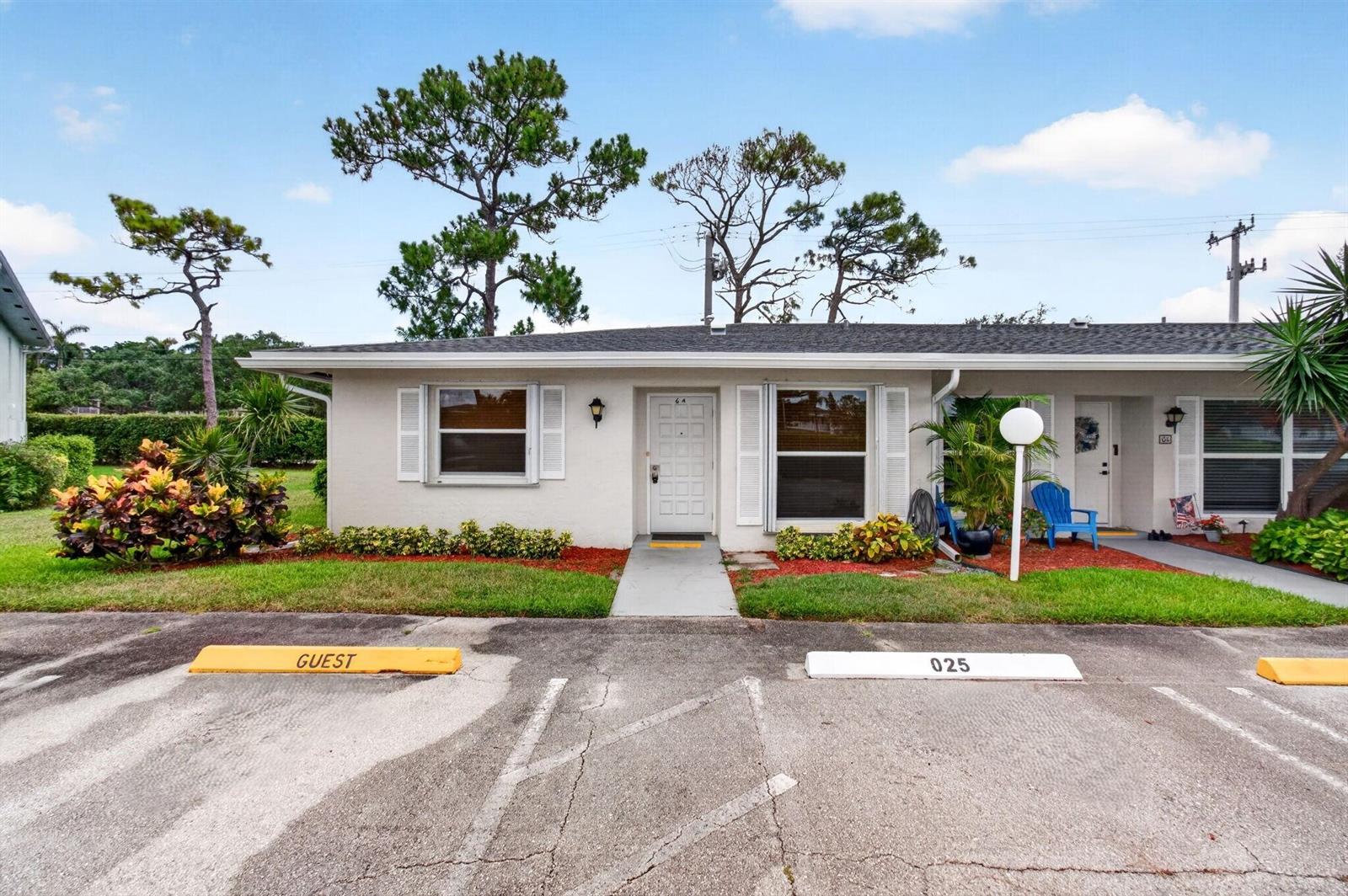 A single-story residential building with a white exterior, two windows, and a front entrance — 2830 SW 15th Street # a, Delray Beach FL 33445, DELRAY BEACH, FL