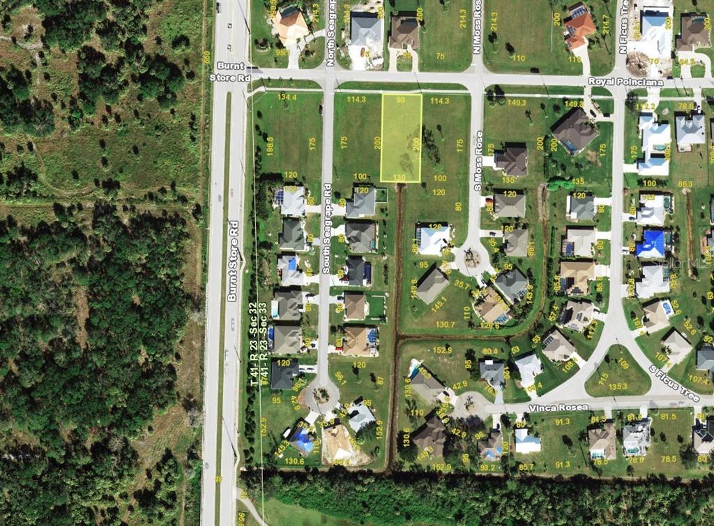 This is an aerial map showing a vacant residential lot highlighted in a suburban neighborhood — 811 ROYAL POINCIANA, PUNTA GORDA, FL
