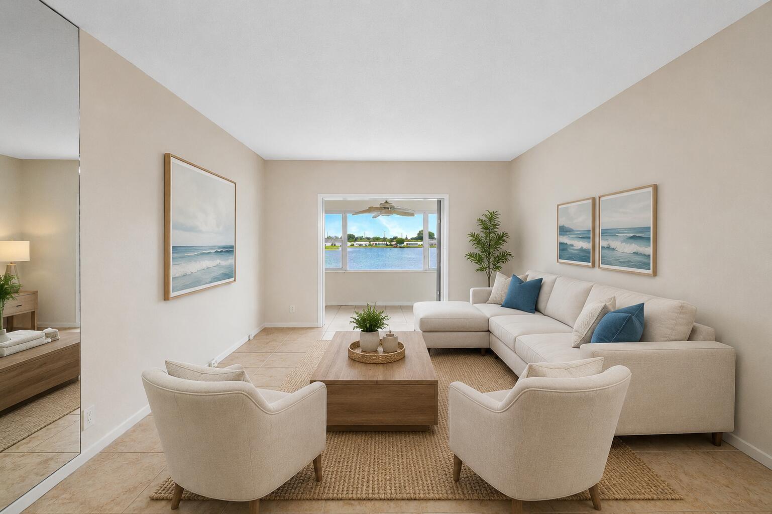A living room features a sectional sofa, two armchairs, a coffee table, and a water view — 1116 Lake Terrace # 207, Boynton Beach FL 33426, BOYNTON BEACH, FL