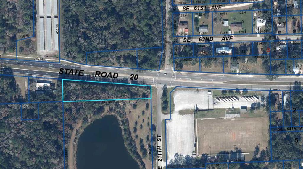 An aerial map shows a vacant, wooded lot outlined in blue along a major highway — SE HAWTHORNE ROAD, HAWTHORNE, FL