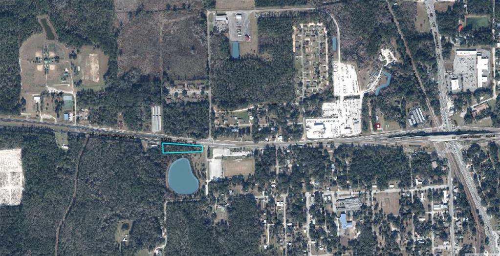 This aerial map shows a rectangular parcel of land outlined in blue along a highway — SE HAWTHORNE ROAD, HAWTHORNE, FL