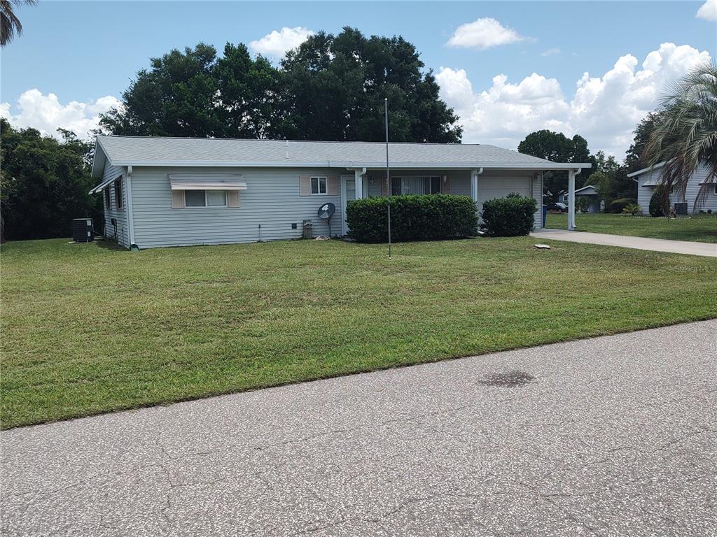 A single-story house with light gray siding and a large front lawn — 6429 SW 107TH STREET, OCALA, FL