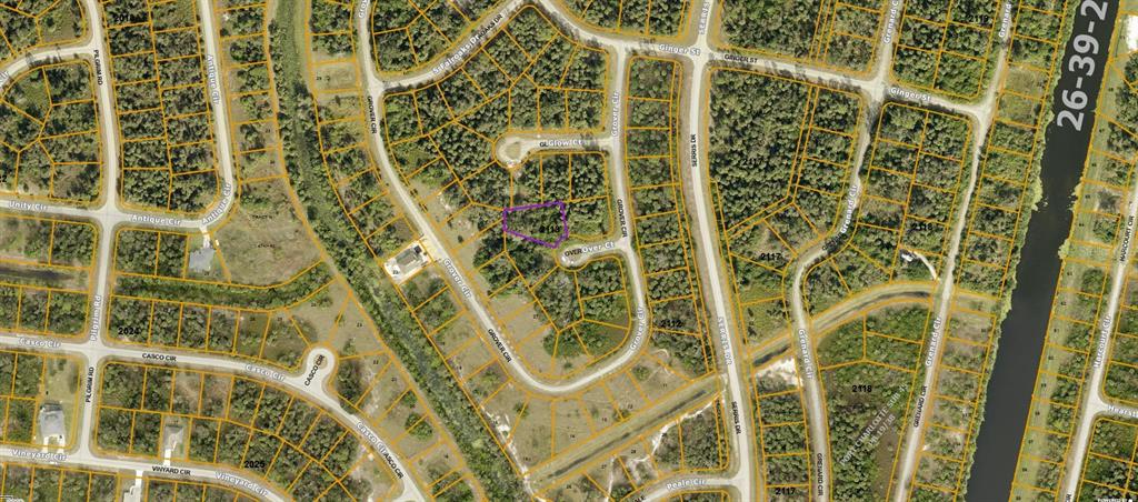 This is an aerial map showing a vacant lot highlighted in purple within a residential neighborhood — OVER COURT, NORTH PORT, FL