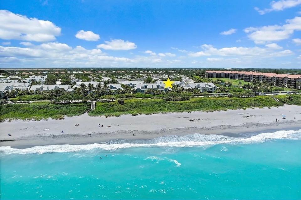 An aerial view of beachfront condominiums with a yellow star marking a specific building — 602 Mainsail Circle, Jupiter FL 33477, JUPITER, FL