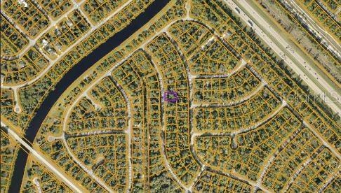 This is an aerial map view of a residential neighborhood with a highlighted property lot — IRONSIDE STREET, NORTH PORT, FL