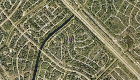 This is an aerial map view of a residential neighborhood with a highlighted property lot — IRONSIDE STREET, NORTH PORT, FL
