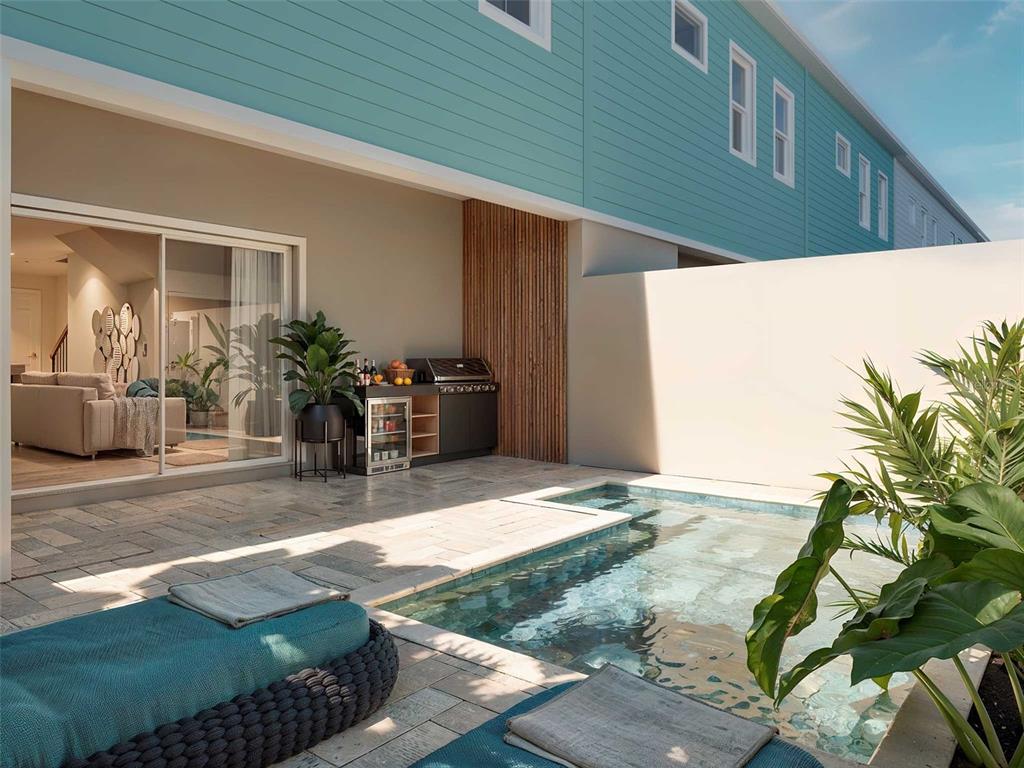 This is a rendering of a patio featuring a small pool, outdoor kitchen, and seating — 119 PEGASUS STREET, DAVENPORT, FL