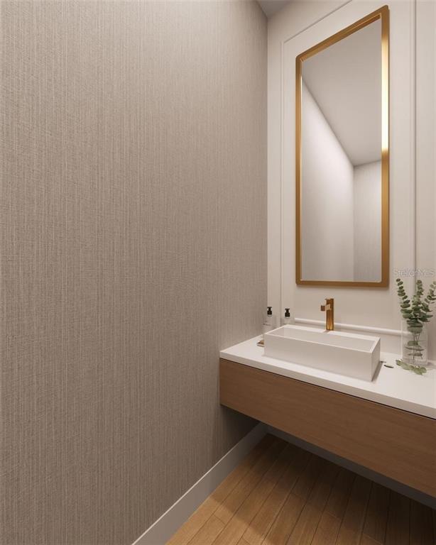 This rendering shows a modern powder room with a floating vanity, vessel sink, and mirror — 650 MEDORA WAY, WINTER GARDEN, FL