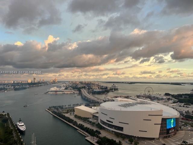 An aerial view shows the Kaseya Center, a bridge, and a harbor at sunset — 900 Biscayne Blvd # 3207, Miami FL 33132, MIAMI, FL