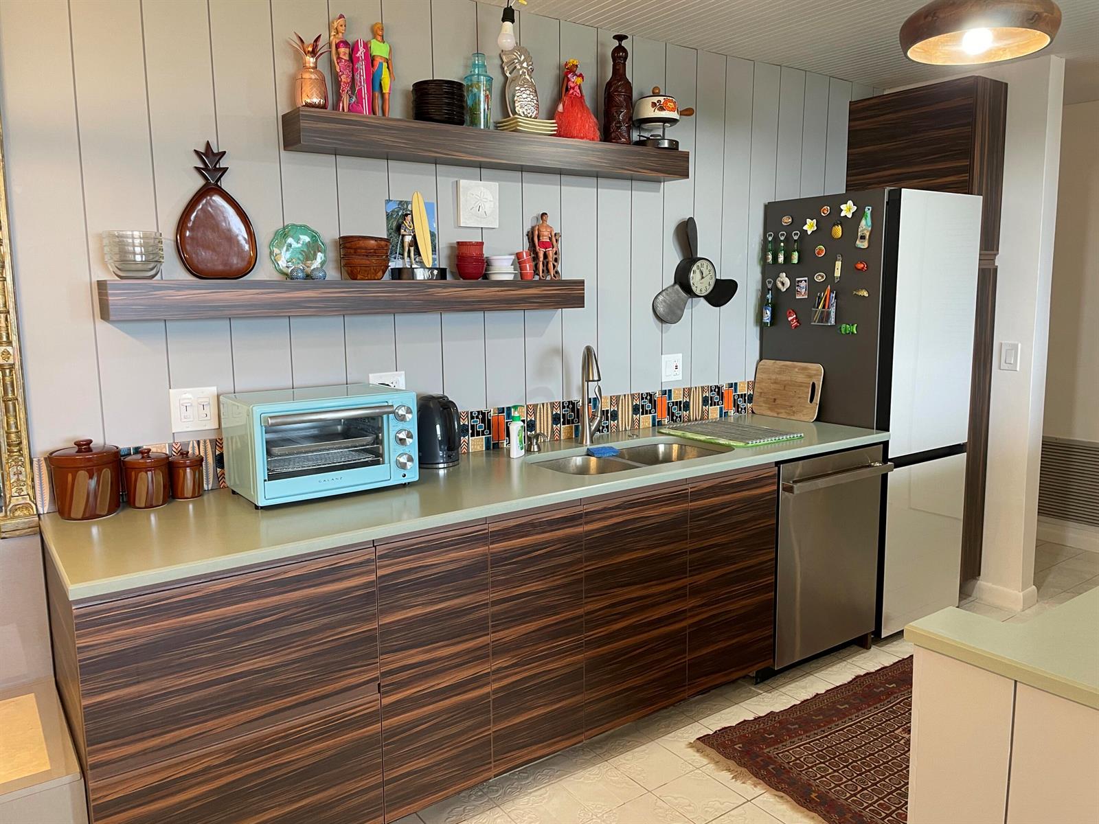 A kitchen features wood-grain cabinets, a light green countertop, open shelving, and a retro toaster oven — 2121 N Ocean Boulevard # 1204e, Boca Raton FL 33431, BOCA RATON, FL