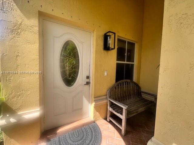 A single-story yellow stucco house with a tiled roof, garage, and front yard landscaping — 803 Vista Meadows Dr, Weston FL 33327, WESTON, FL