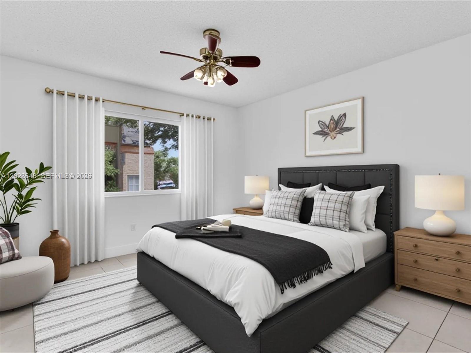 A bedroom features a dark upholstered bed, white walls, a ceiling fan, and a window — 18850 NW 57th Ave # 208, Hialeah FL 33015, HIALEAH, FL