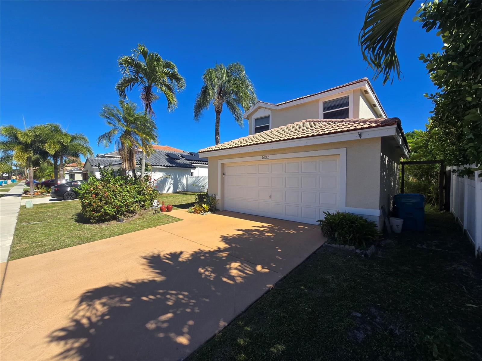 A two-story house with a tan stucco exterior, a tile roof, and a two-car garage — 7082 Middlebury Drive, Boynton Beach FL 33436, BOYNTON BEACH, FL