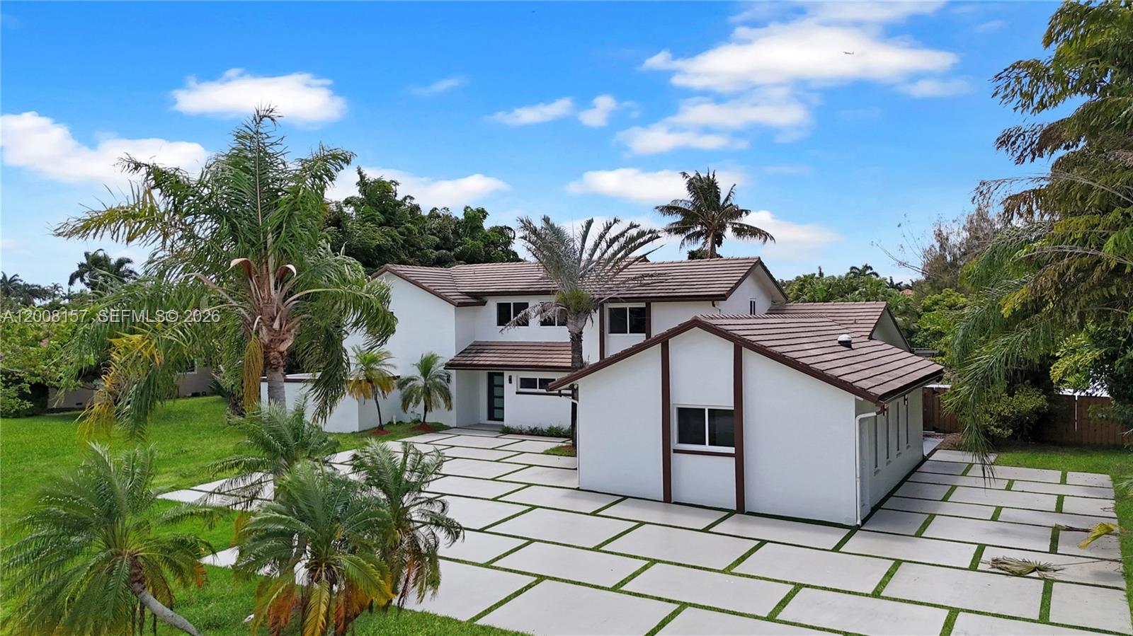 A two-story white house with a brown tile roof and a large paved driveway — 2181 SW 117th Ter, Davie FL 33325, DAVIE, FL