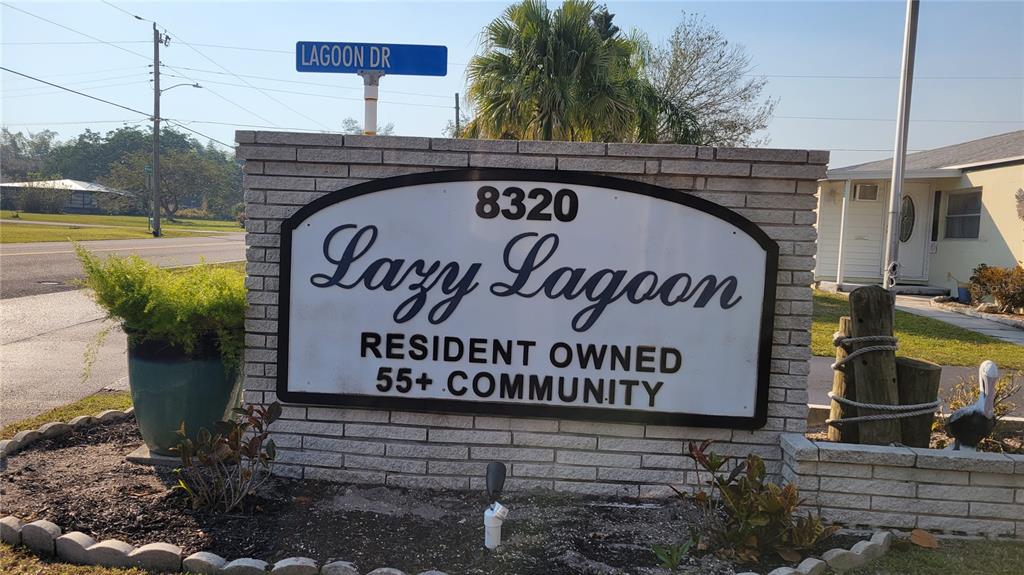 A brick sign for a 55+ community stands near a street sign for Lagoon Dr — 123 6TH STREET, PUNTA GORDA, FL