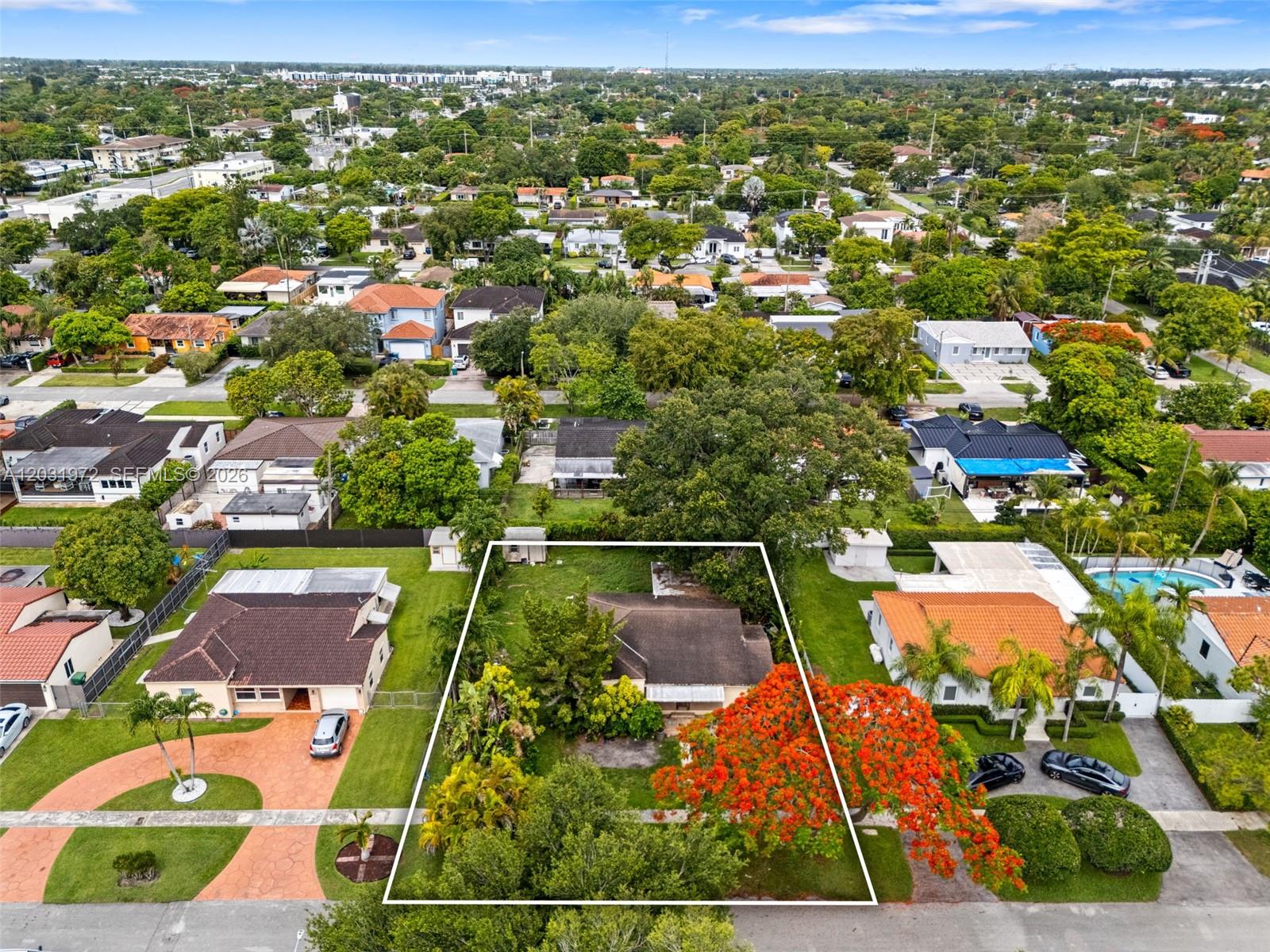 An aerial view shows a residential property with a house, large trees, and landscaping — 3900 SW 59th Ave, Miami FL 33155, MIAMI, FL