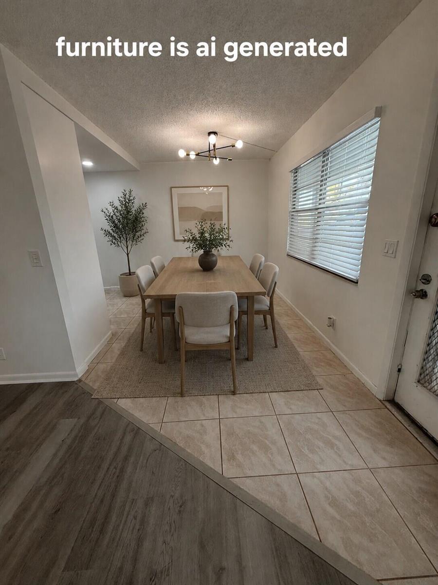 A dining room with tile flooring, a light wood table, and chairs featuring AI-generated furniture — 3089 Yarmouth E # 3089, Boca Raton FL 33434, BOCA RATON, FL