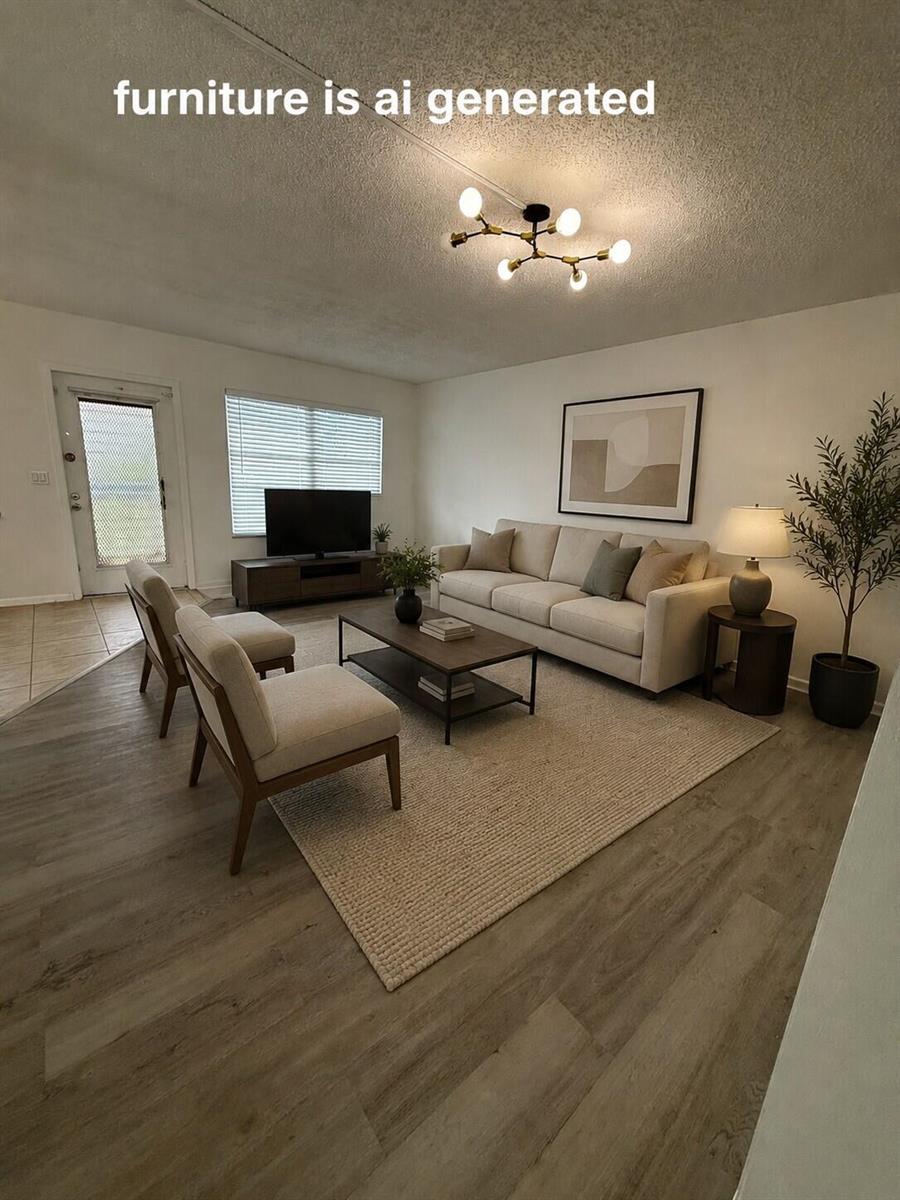 This living room features light wood-look flooring, a ceiling light fixture, and AI-generated furniture — 3089 Yarmouth E # 3089, Boca Raton FL 33434, BOCA RATON, FL