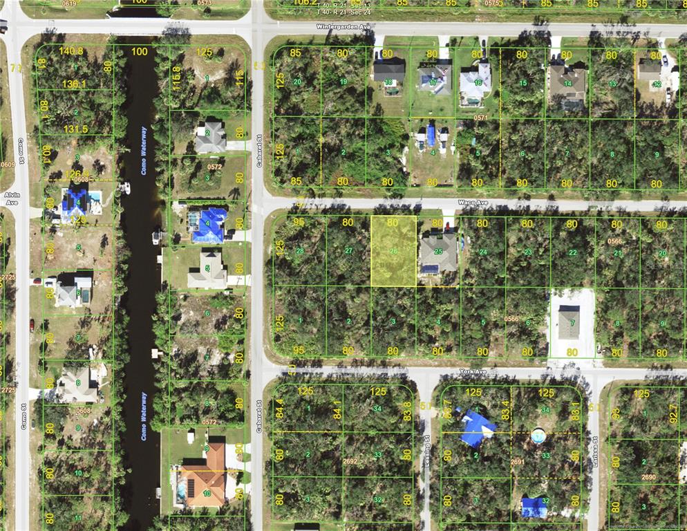 This is an aerial map showing residential lots, streets, and a waterway — 17311 WACO (LOT 26) AVENUE, PORT CHARLOTTE, FL