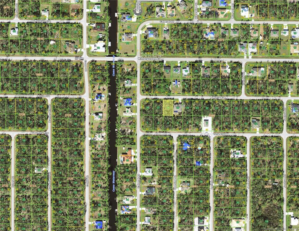 This is an aerial map showing residential lots, streets, and a waterway — 17311 WACO (LOT 26) AVENUE, PORT CHARLOTTE, FL