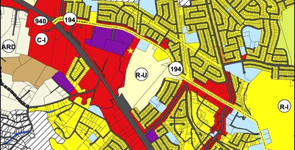 This image is a color-coded zoning map showing various land use designations and road layouts — PR-194 KM 0.9, FAJARDO, PR