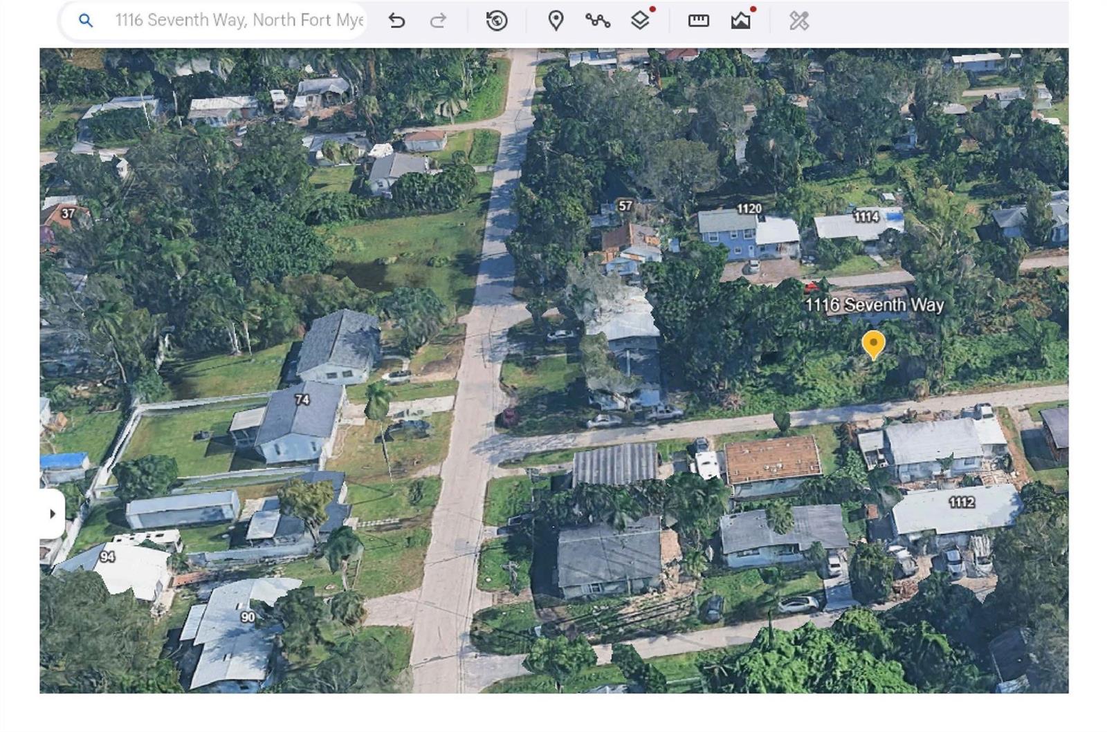 An aerial view shows a residential neighborhood with houses, trees, and a paved street — 1116 7th Way, FL 33903, FL