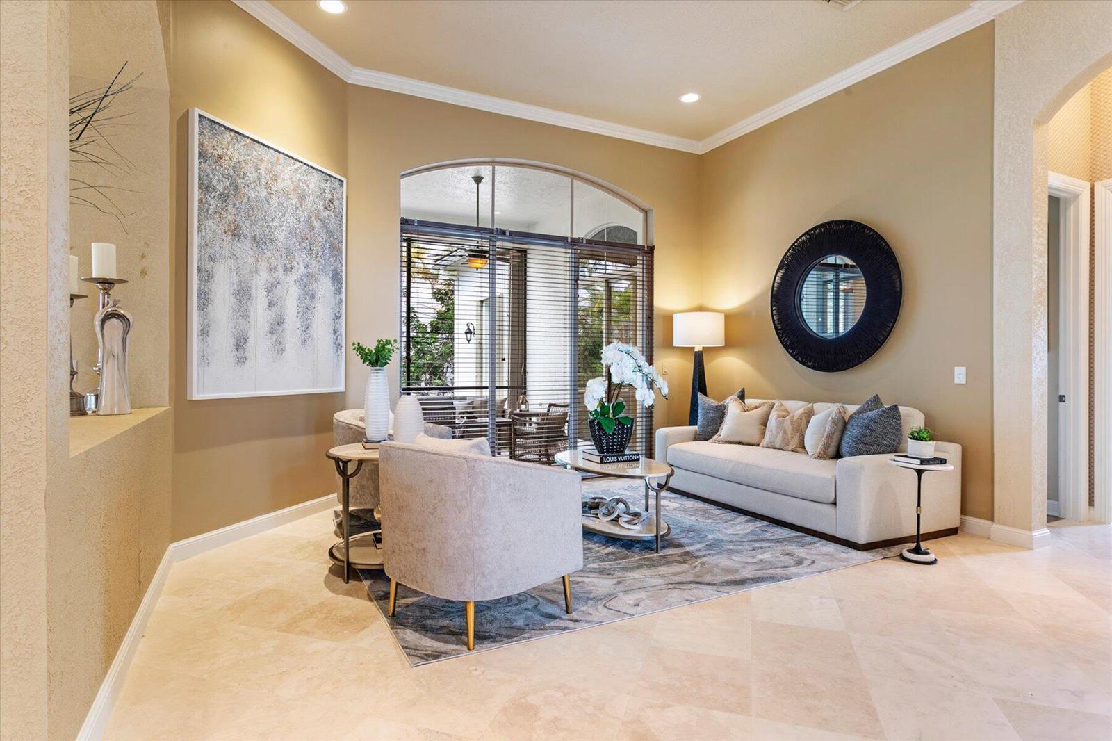 A living room features a beige sofa, two armchairs, a round mirror, and tile flooring — 6059 Bither Way, Lake Worth FL 33467, LAKE WORTH, FL