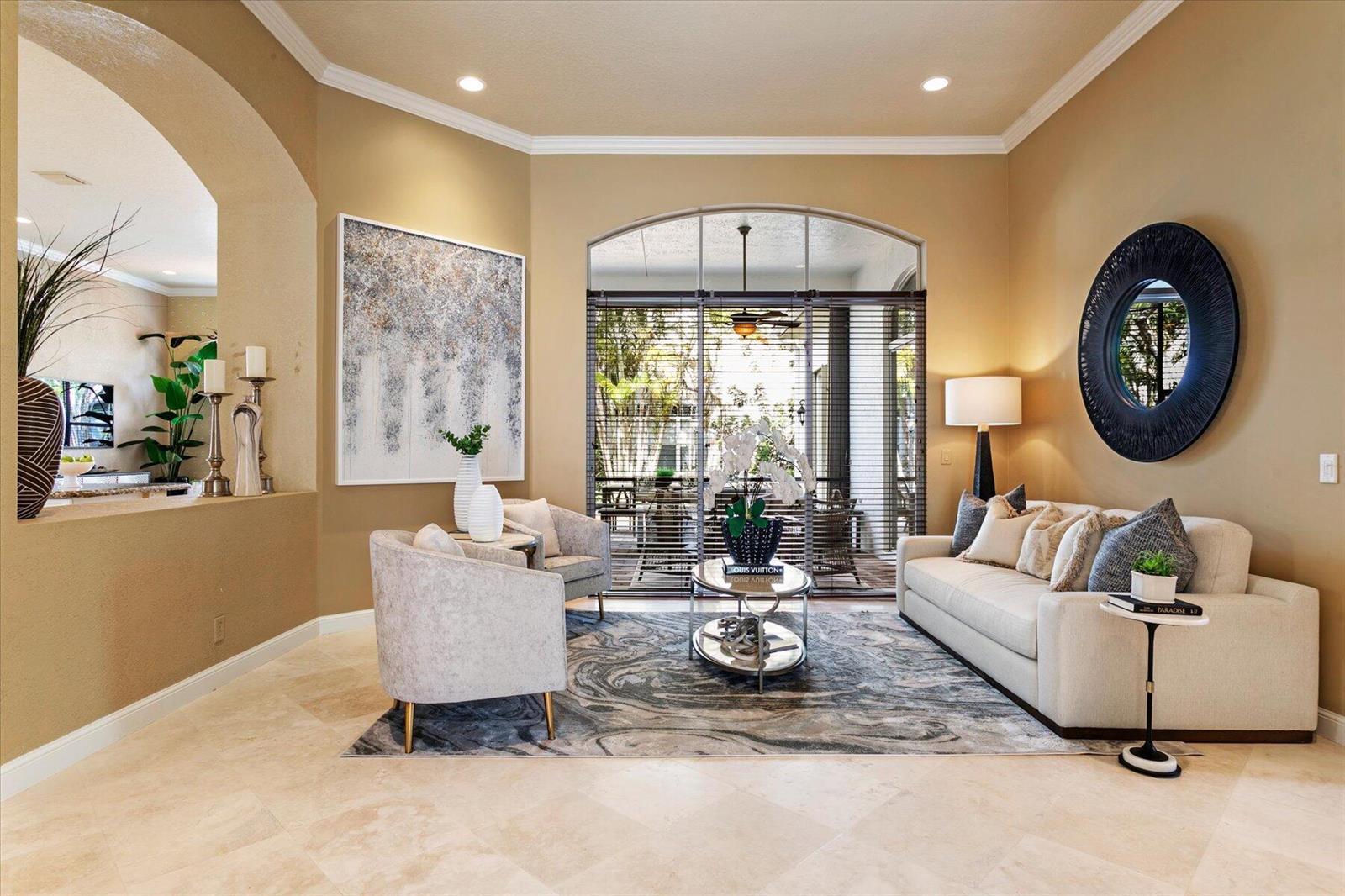 A living room features a beige sofa, two armchairs, a marble-patterned rug, and arched windows — 6059 Bither Way, Lake Worth FL 33467, LAKE WORTH, FL