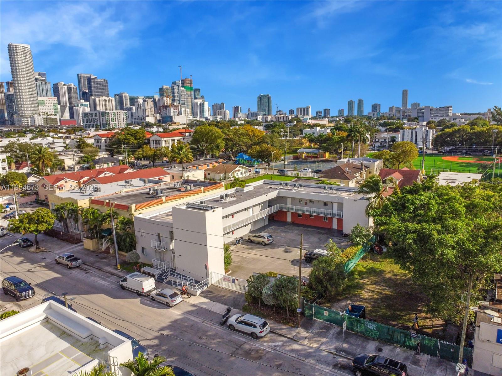 An aerial view shows a two-story apartment building with a central parking lot — 750 SW 2nd St, Miami FL 33130, MIAMI, FL