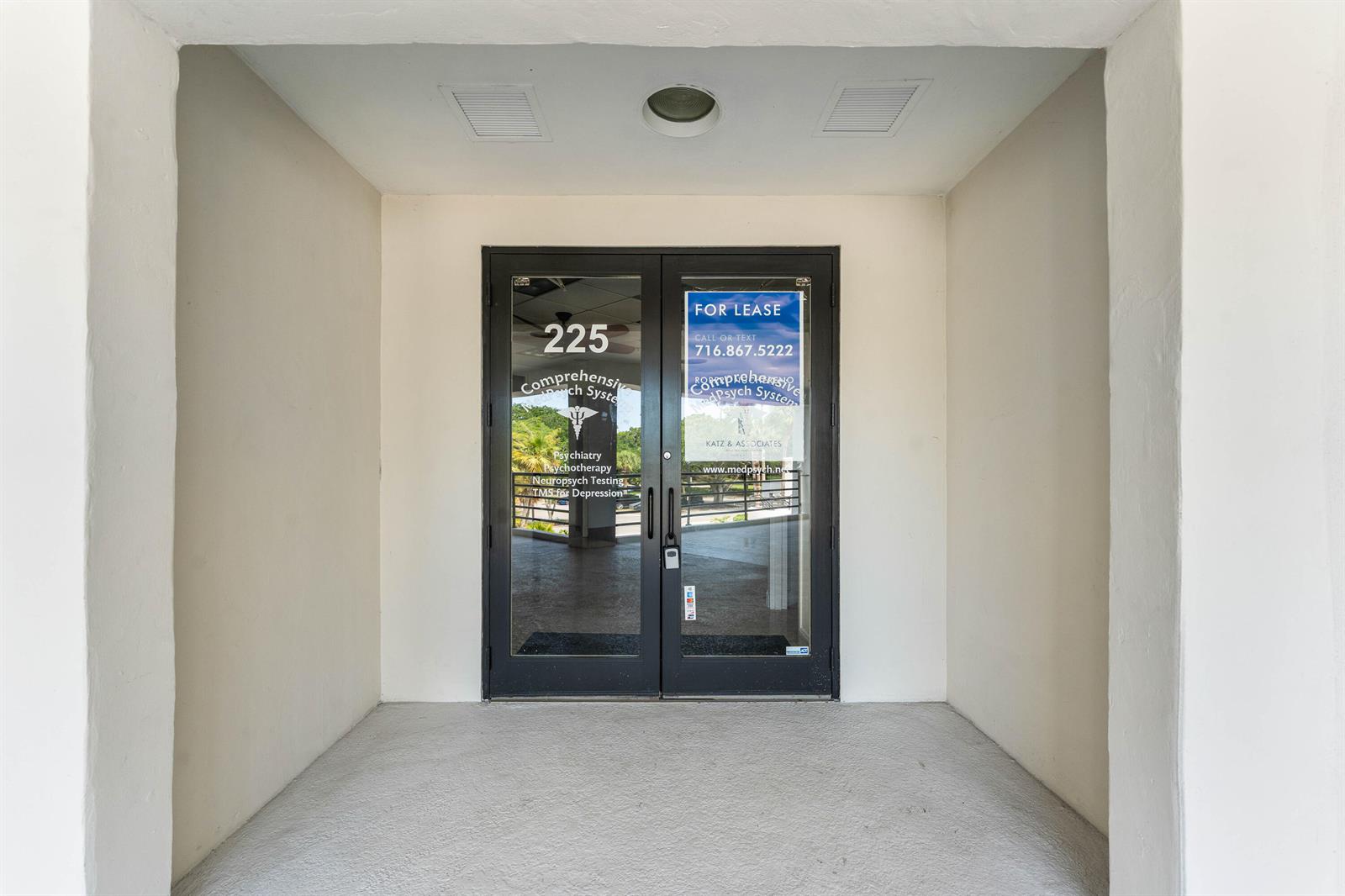 A double glass door entrance to a commercial office space with a for lease sign — 7880 Glades Road, Boca Raton FL 33434, BOCA RATON, FL