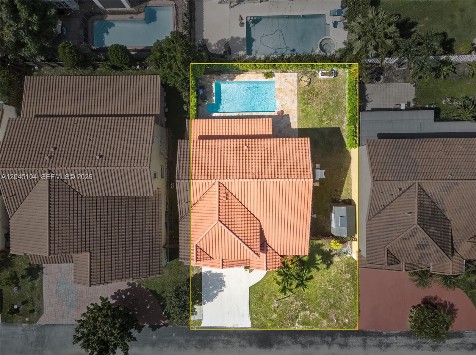 An aerial view shows a residential house with a tiled roof, pool, and backyard — 15602 SW 109th Ter, Miami FL 33196, MIAMI, FL