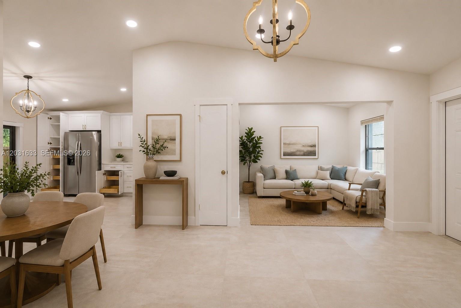 An open-concept living area features a dining space, kitchen with stainless appliances, and a lounge — 11903 SW 110th St Cir E # 11903, Miami FL 33186, MIAMI, FL