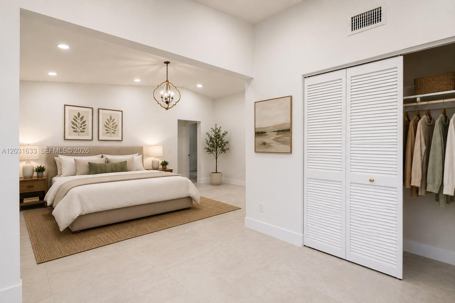 A bedroom features a king bed, neutral decor, tiled floors, and an open closet — 11903 SW 110th St Cir E # 11903, Miami FL 33186, MIAMI, FL