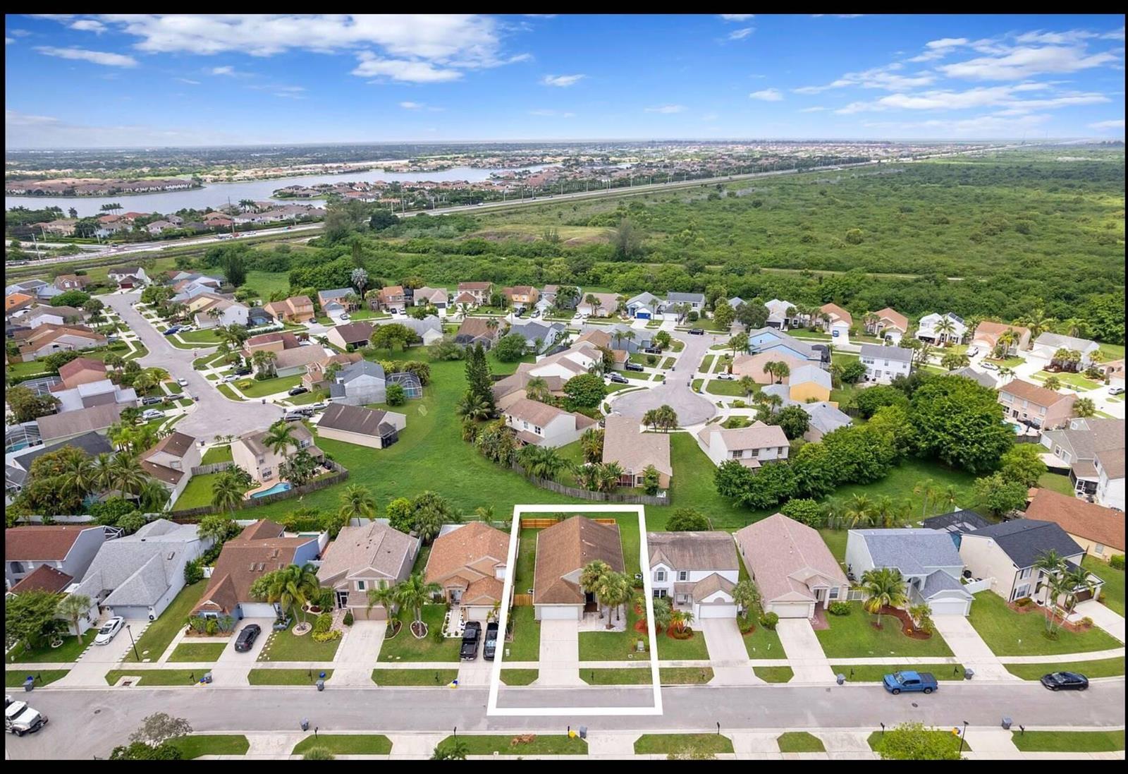 An aerial view shows a single-story house highlighted in a white box within a neighborhood — 22449 Middletown Drive, Boca Raton FL 33428, BOCA RATON, FL