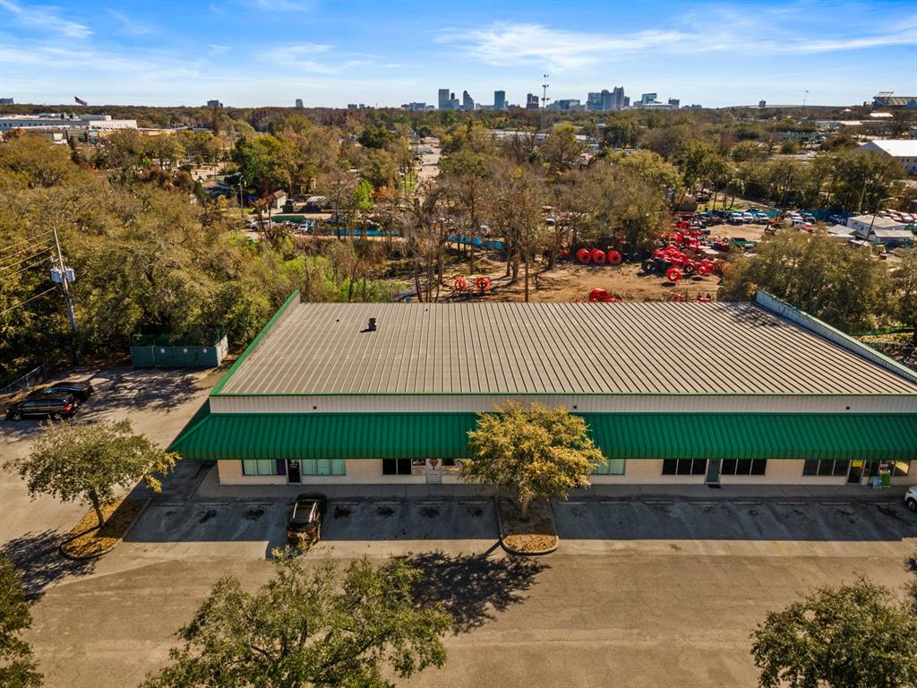 An aerial view shows a single-story commercial building with a green metal roof and awning — 3239 OLD WINTER GARDEN ROAD UNIT 13, ORLANDO, FL