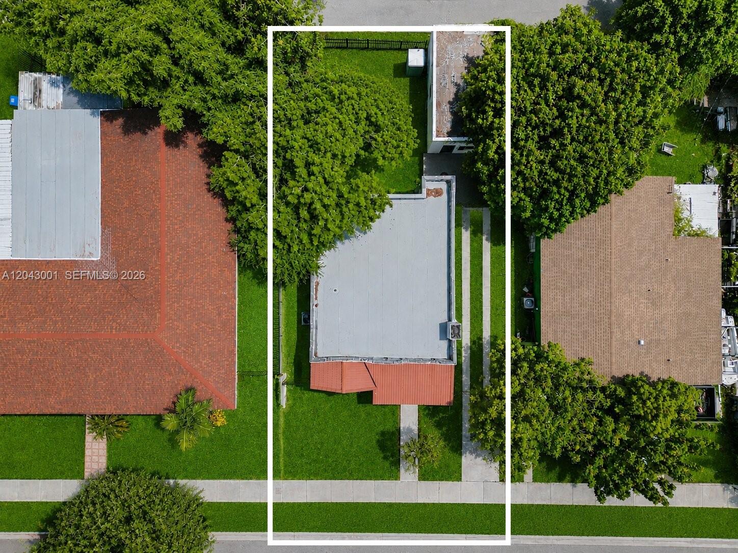 An aerial view shows a residential property with a flat-roofed house and a detached garage — 1020 NW 49th St, Miami FL 33127, MIAMI, FL