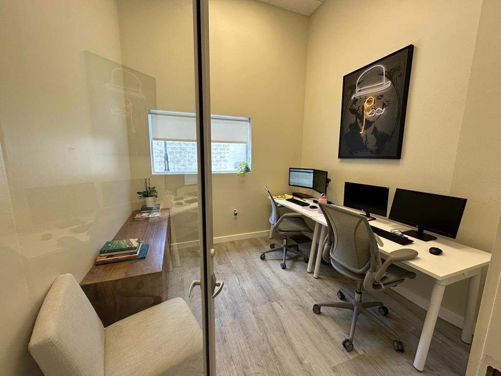 A small office features two desks, two chairs, a wooden bench, and wall art — 425 NW 10th Terrace, Hallandale Beach FL 33009, HALLANDALE BEACH, FL