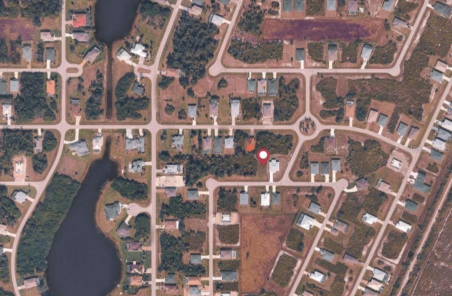 This aerial map shows a residential neighborhood with a red pin marking a specific lot — 149 WRIGHT DRIVE, ROTONDA WEST, FL