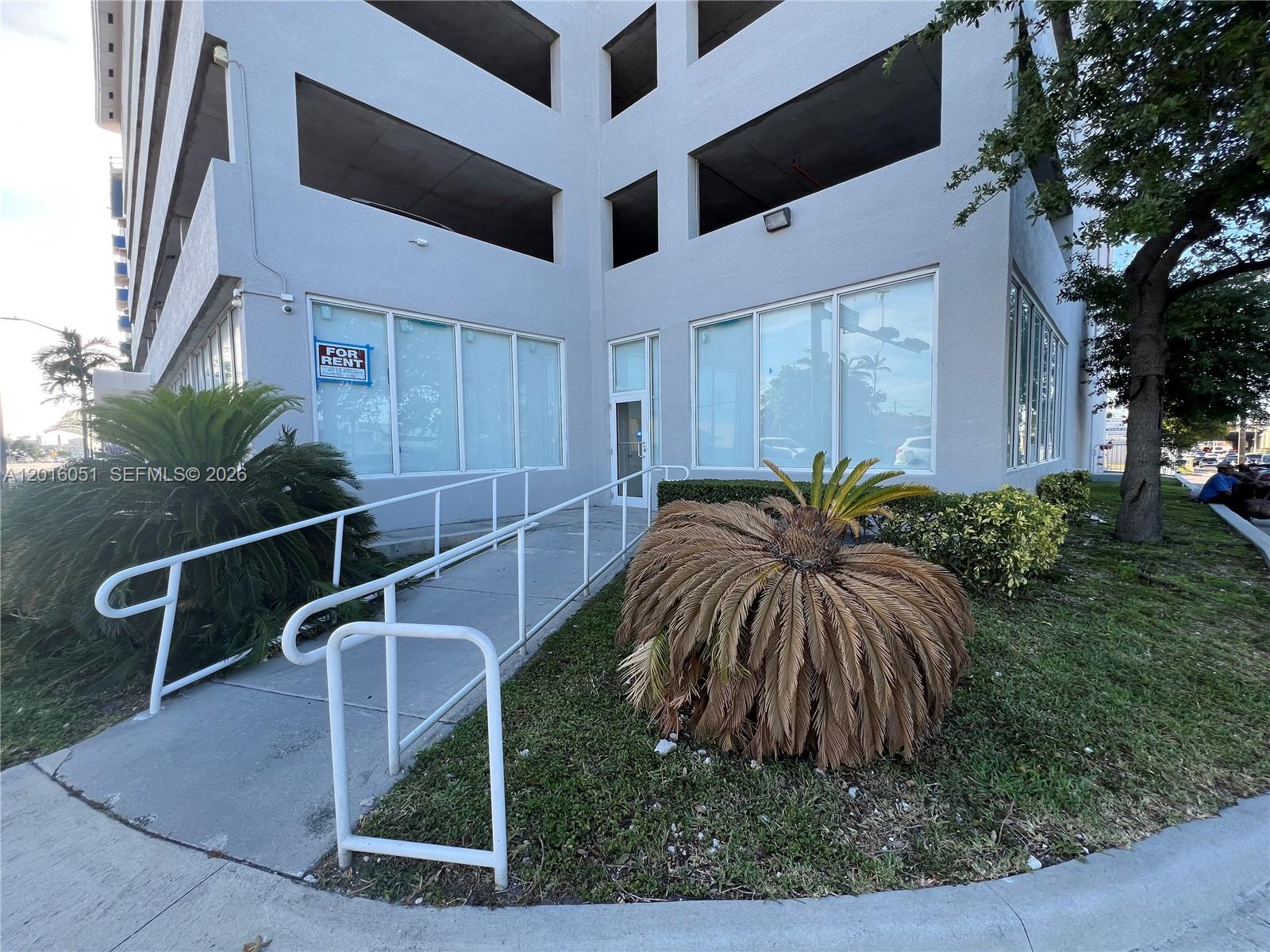 A ground-level commercial entrance features a wheelchair ramp, large windows, and a "For Rent" sign — 2217 NW 7th St # 2, Miami FL 33125, MIAMI, FL