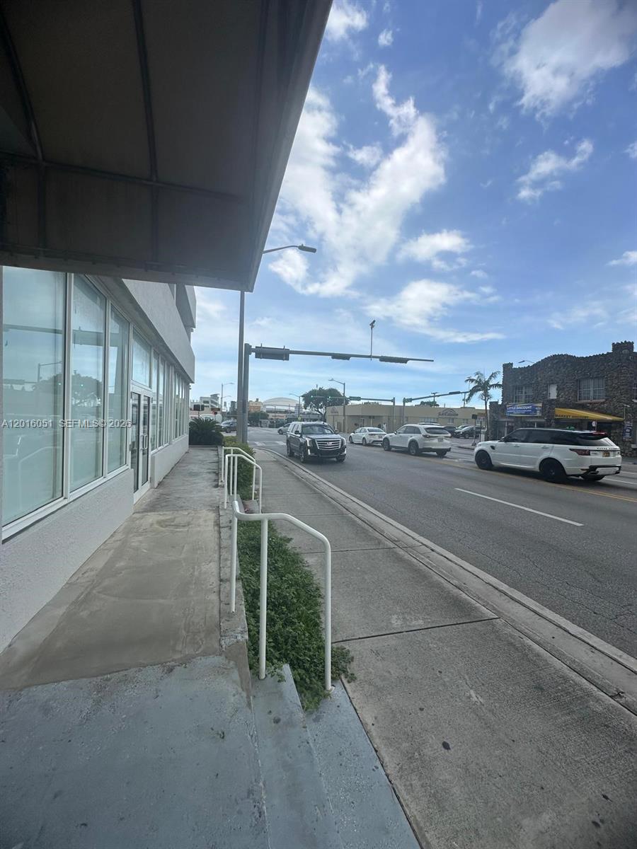 An exterior view shows a sidewalk and street with cars in front of a building — 2217 NW 7th St # 2, Miami FL 33125, MIAMI, FL