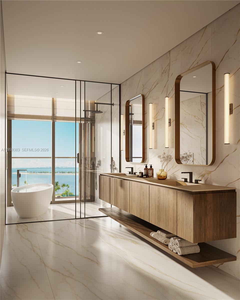 This rendering shows a modern bathroom with a double vanity, soaking tub, and ocean view — 1880 Brickell Avenue # 18, Miami FL 33129, MIAMI, FL