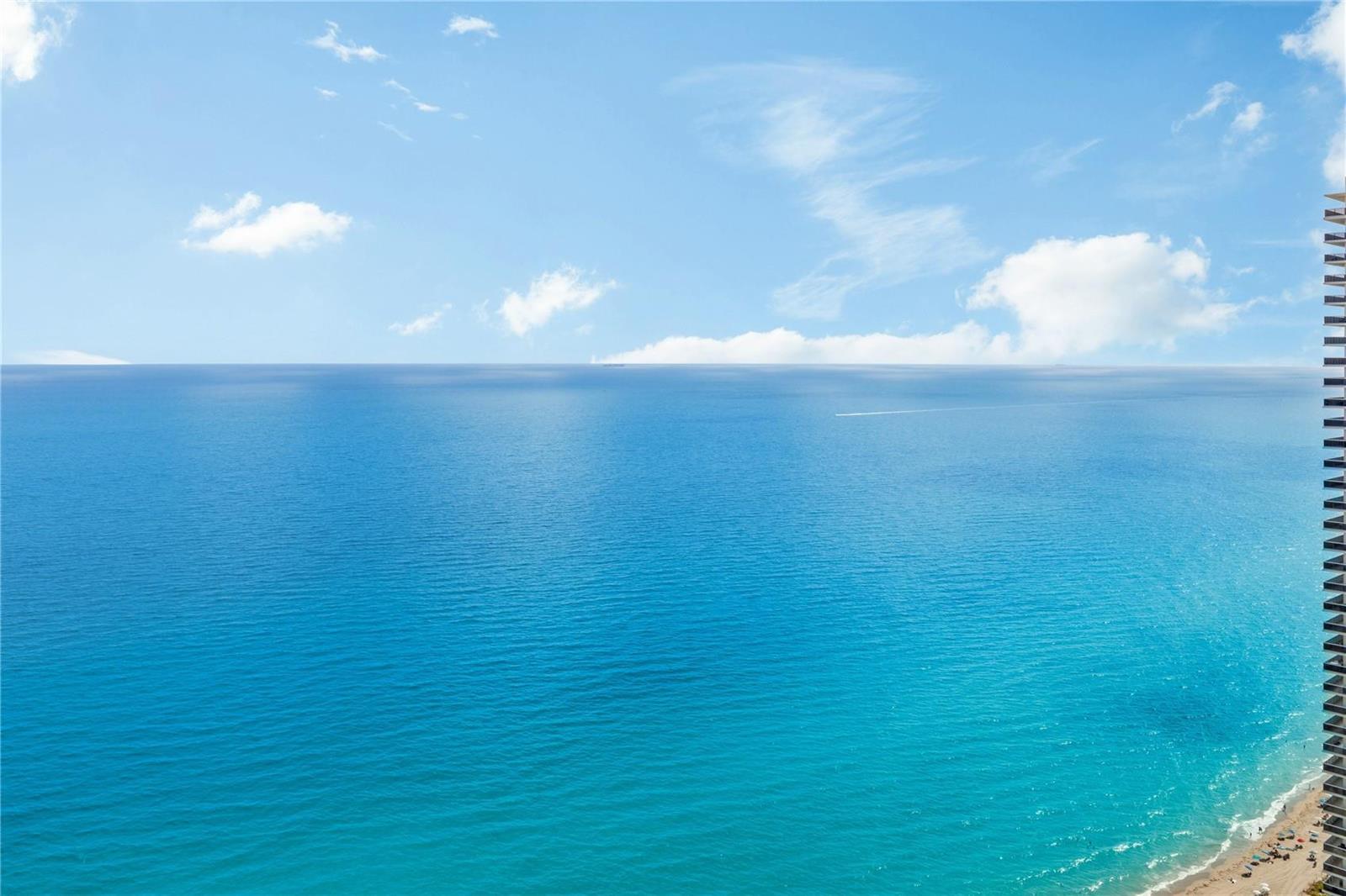 An elevated view of the ocean and beach from a high-rise balcony — 4111 S Ocean Drive, Hollywood FL 33019, HOLLYWOOD, FL