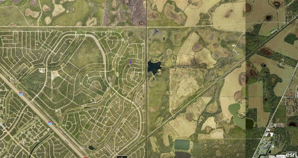 This aerial map shows a residential development adjacent to undeveloped land and rural fields — 1128226043 CRIMSONGLORY ROAD, NORTH PORT, FL