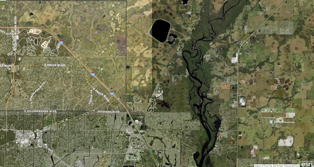 This is an aerial map showing residential streets, a river, and a large reservoir — 1128226043 CRIMSONGLORY ROAD, NORTH PORT, FL