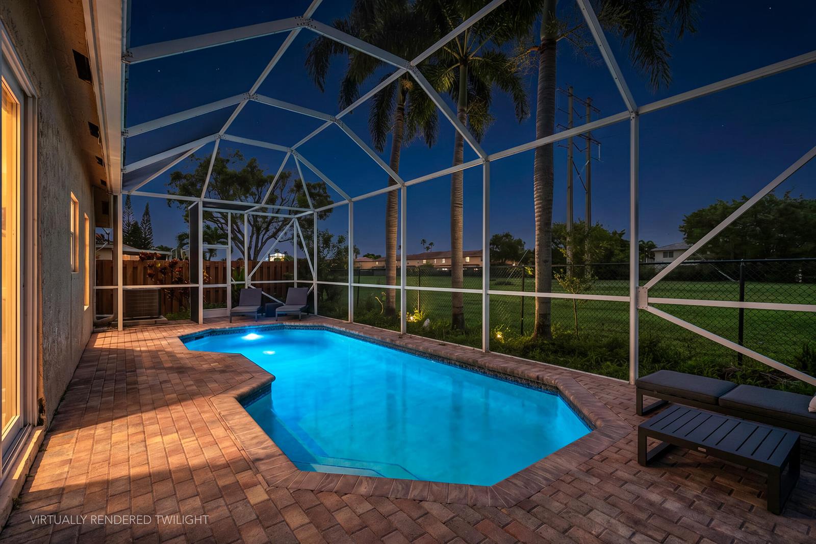 A virtually rendered twilight view of a backyard swimming pool enclosed by a screened lanai — 376 E Royal Cove Circle, Davie FL 33325, DAVIE, FL