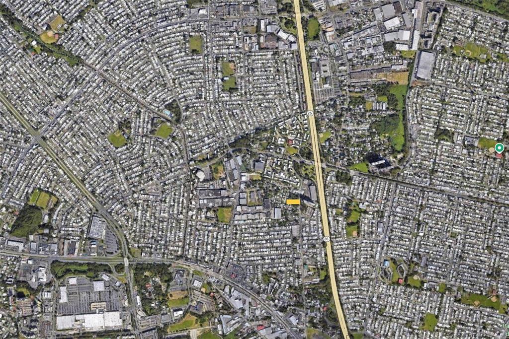 This is an aerial view of a residential neighborhood bisected by a major highway — CALLE ANDINO, CAROLINA, PR