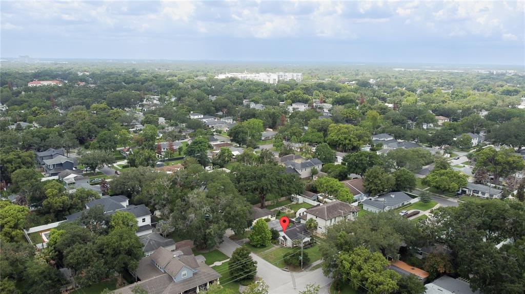 An aerial view shows a residential neighborhood with a red location pin on a house — 2942 HELEN AVENUE, ORLANDO, FL