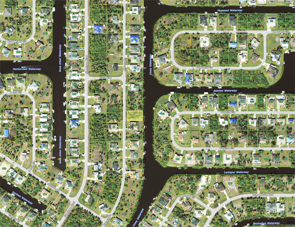 This is a satellite map showing residential lots and waterways in a suburban neighborhood — 4234 LIBRARY STREET, PORT CHARLOTTE, FL
