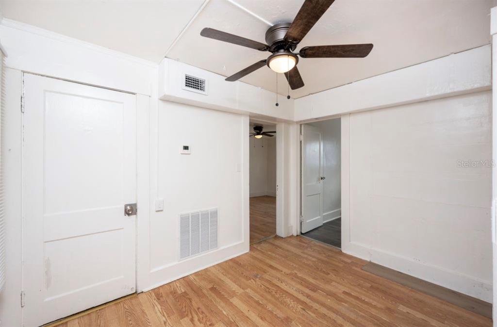 A kitchen area features a white refrigerator, microwave, sink, and a front-loading washing machine — 1701 14TH AVENUE S UNIT A, ST PETERSBURG, FL